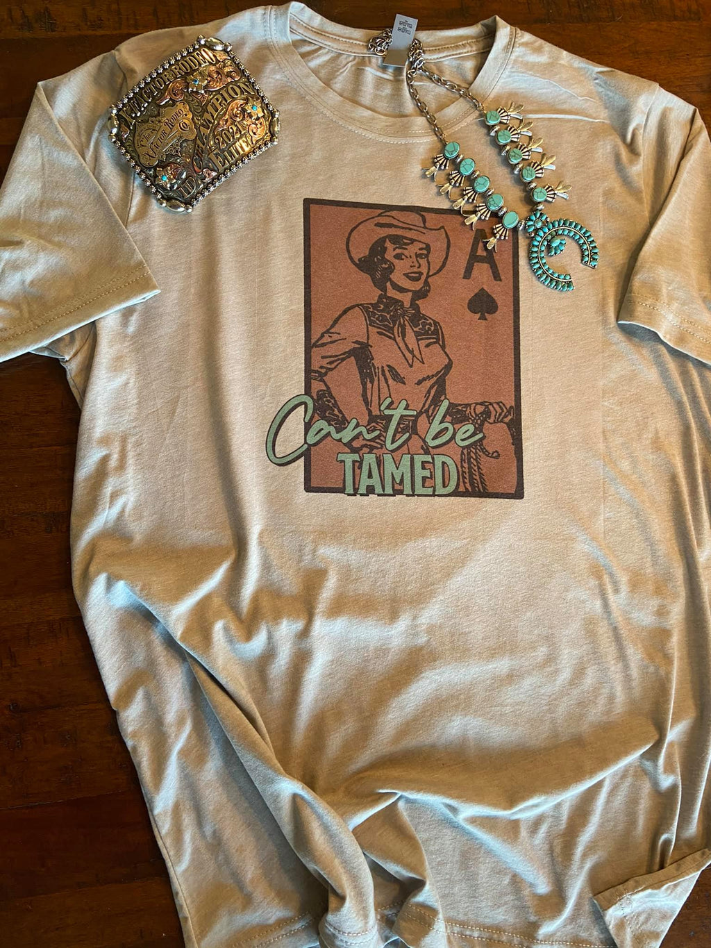 Can’t Be Tamed Graphic Tee – Western Lifestyle T-Shirt | Wholesale Apparel | Stockline Supply Co